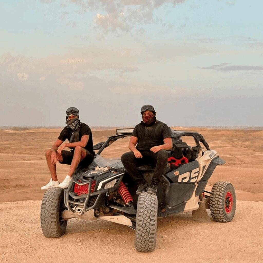 Agafay Buggy Adventure with Sunset & Desert Dinner Two adventurers enjoying buggy ride in Agafay desert Marrakech