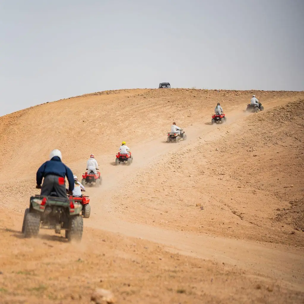 Agafay Desert Quad & Camel Ride with Luxury Dinner Show 4 Group quad tour exploring Agafay desert trails