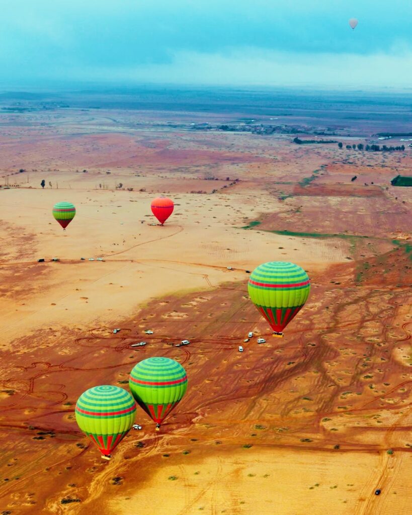 Aerial view of hot air balloons flying over Agafay desert in Marrakech