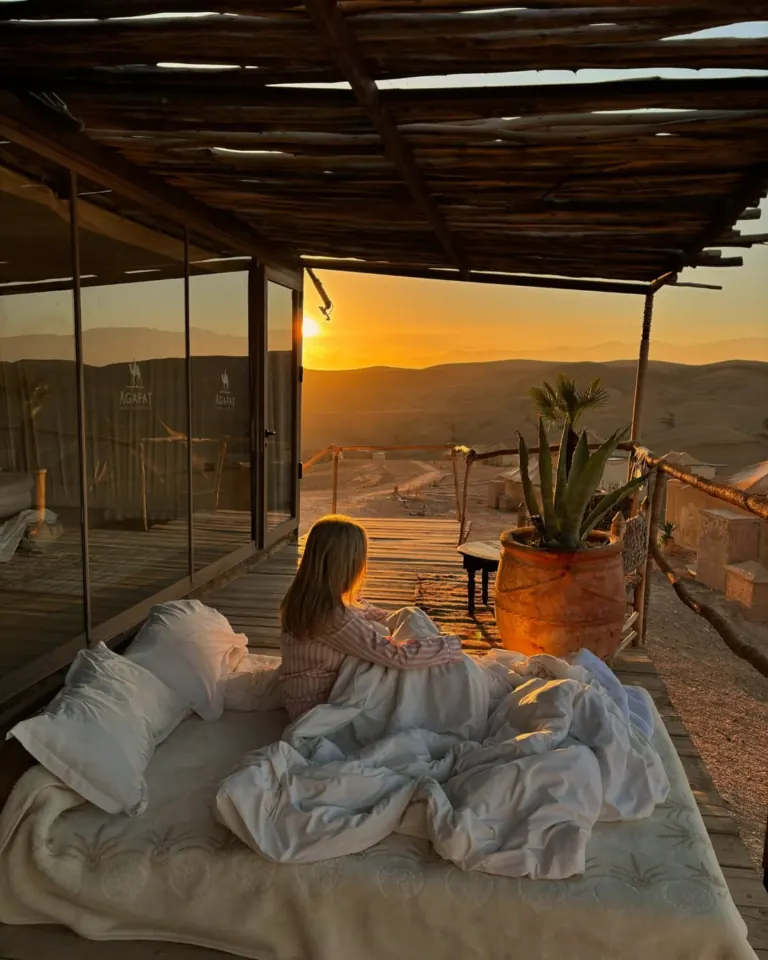 Sunset over the Agafay desert from a camp terrace