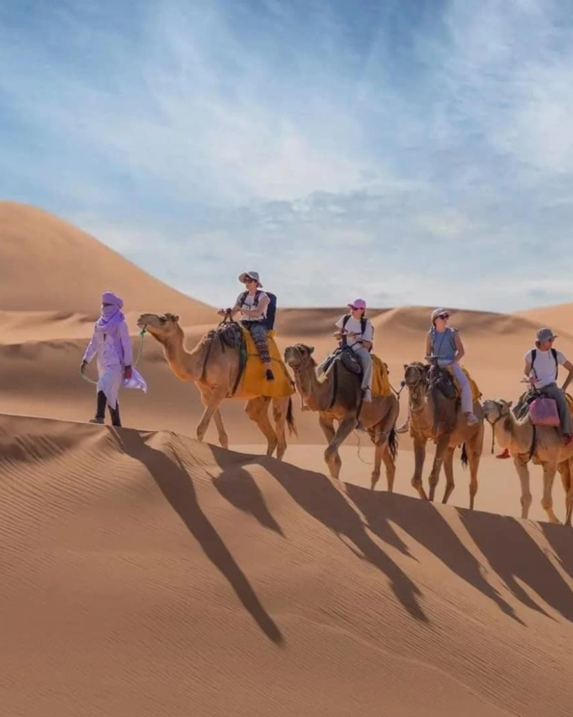 Sunset-camel-ride-across-Erg-Chebbi-dunes-during-3-day-desert-tour-from-Marrakech-to-Merzouga
