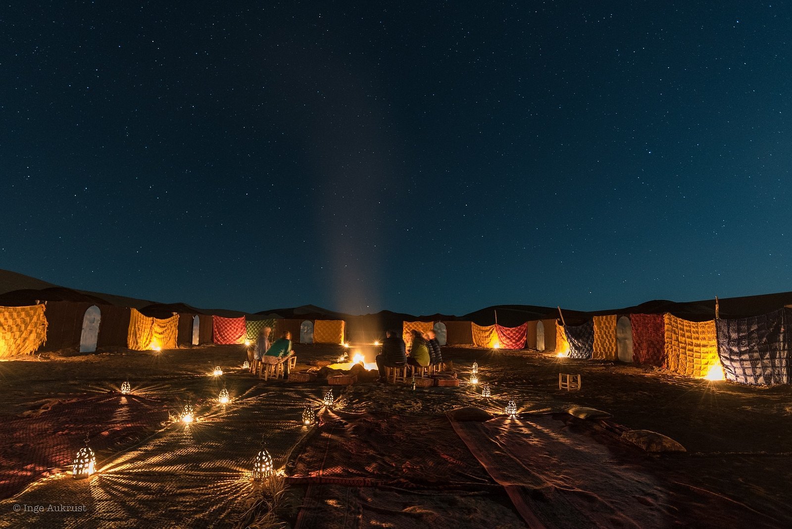 Marrakech in December: Weather, Christmas & New Year Guide 5 Candlelit Moroccan dinner setup near Marrakech on a cool December evening
