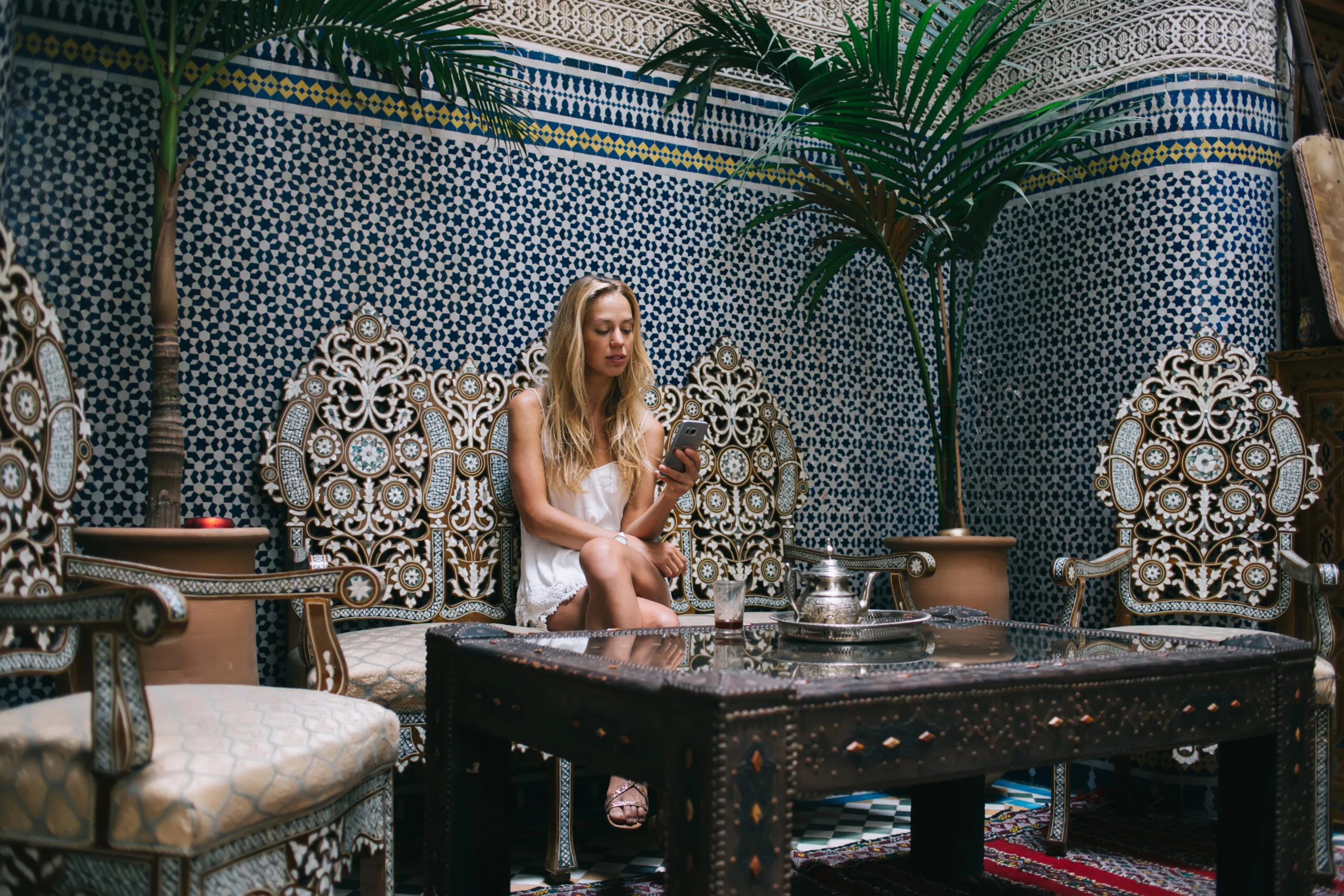 Marrakech New Year 2027 — Where to Celebrate (Local's Guide) 2 Candlelit riad courtyard in Marrakech set for a New Year gala dinner