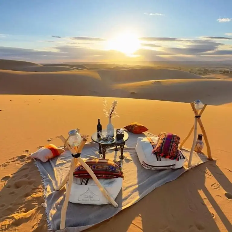A private picnic laid out on the Erg Chebbi dunes at sunset