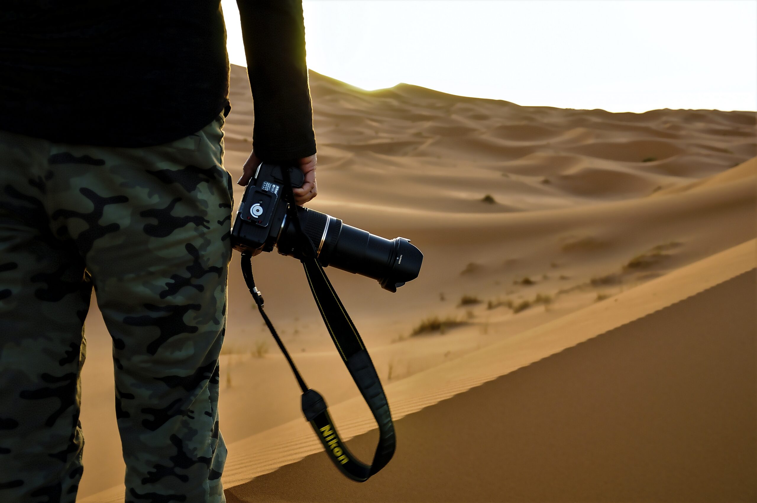 Blog 3 closeup shot of a man shotting the sahara desert i 2026 03 18 08 22 22 utc Sahara Desert Photography scaled