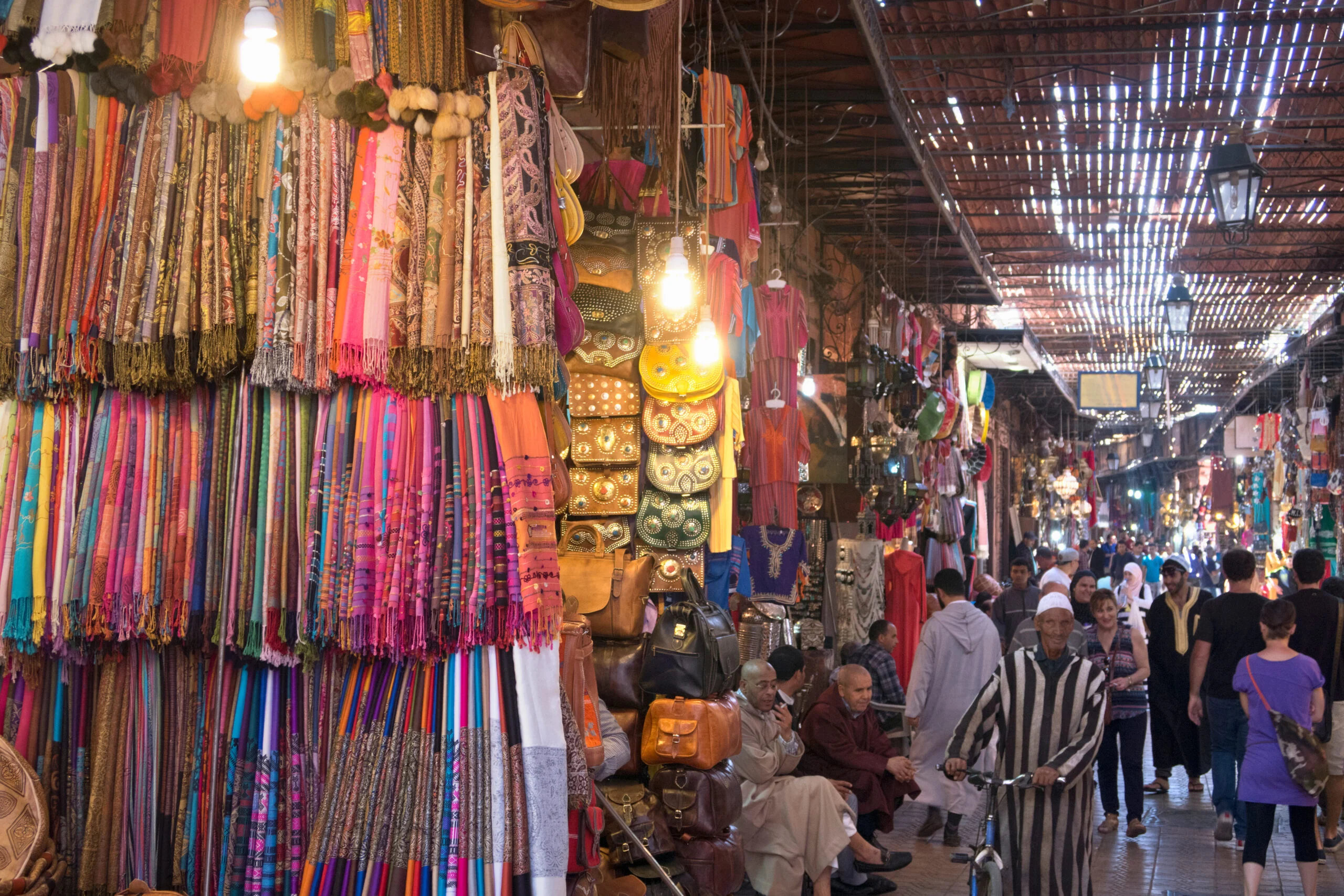 Marrakech New Year 2027 — Where to Celebrate (Local's Guide) 4 Marrakech medina market glowing at night near Jemaa el-Fna on New Year's Eve
