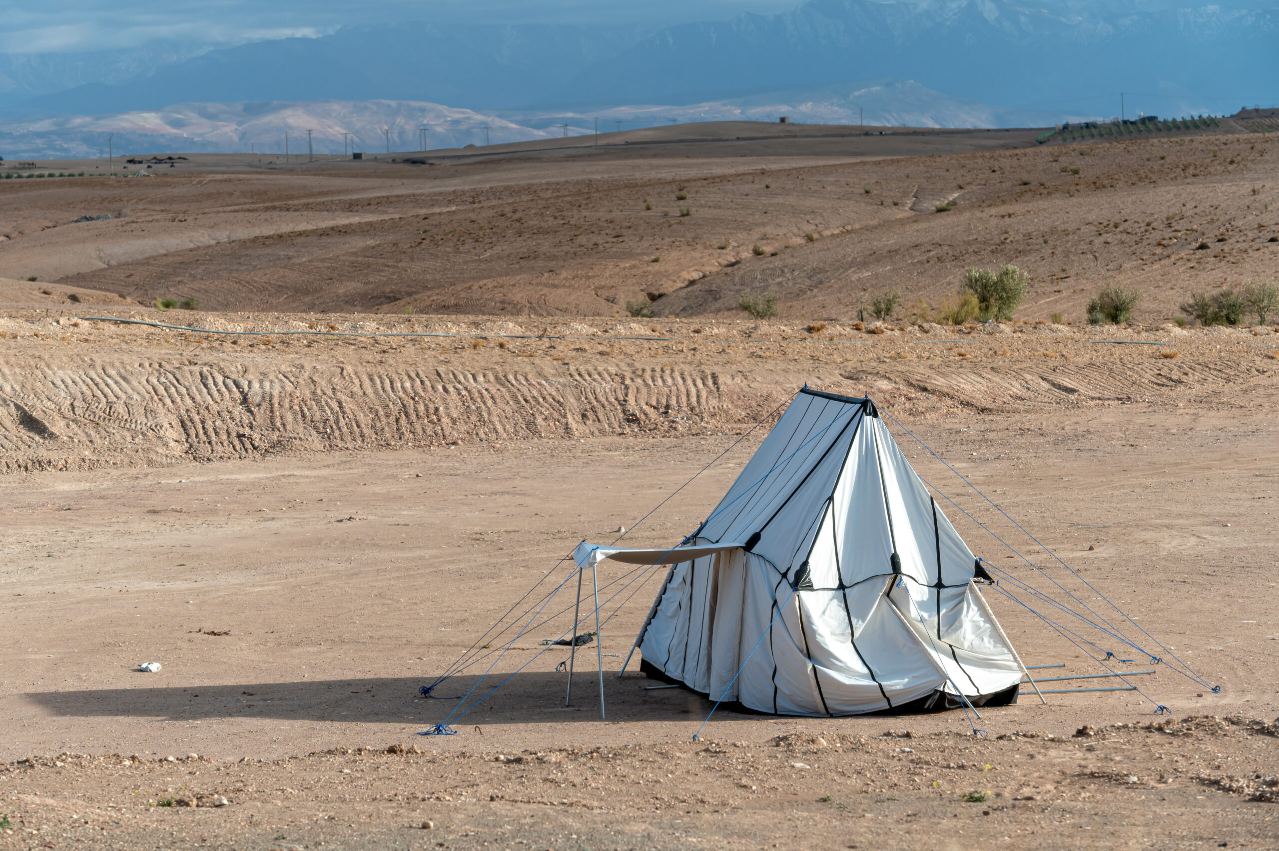 A tent pitched in the Agafay desert near Marrakech, Morocco — a popular setting for desert weddings